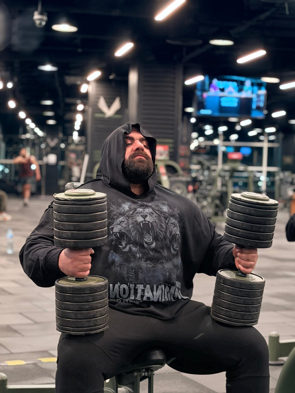 Person lifting dumbbells in a gym setting